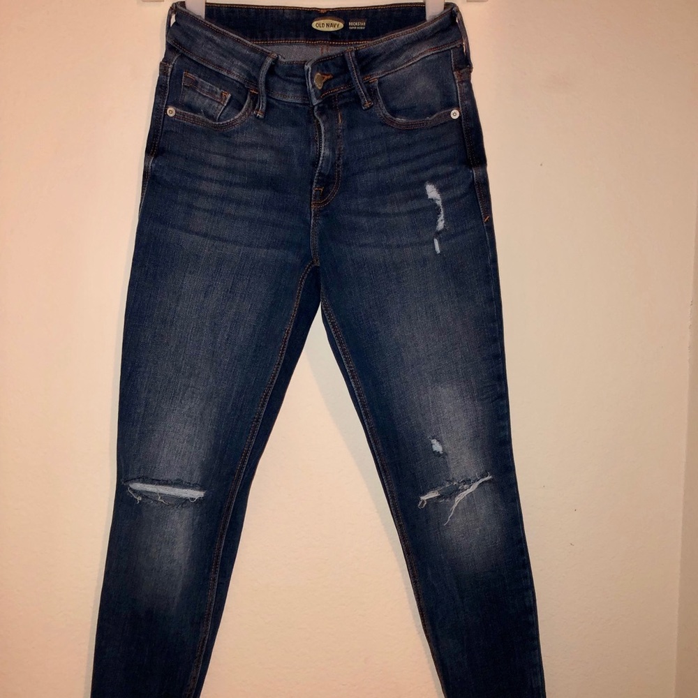 Mid-rise distressed jeans